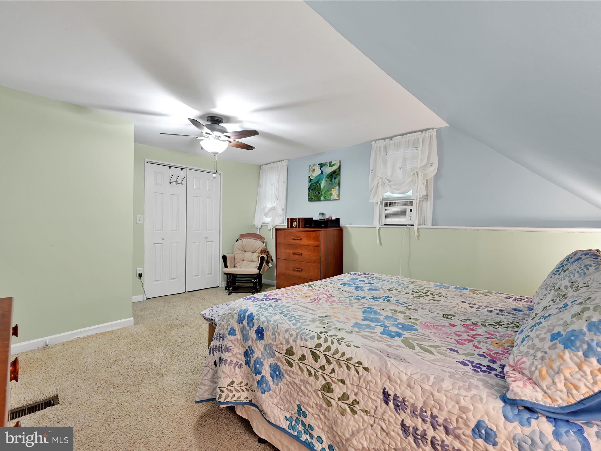 5 Hershey Road Lititz, PA 17543 - Photo 15 of 32 a bedroom with a large bed and a chandelier
