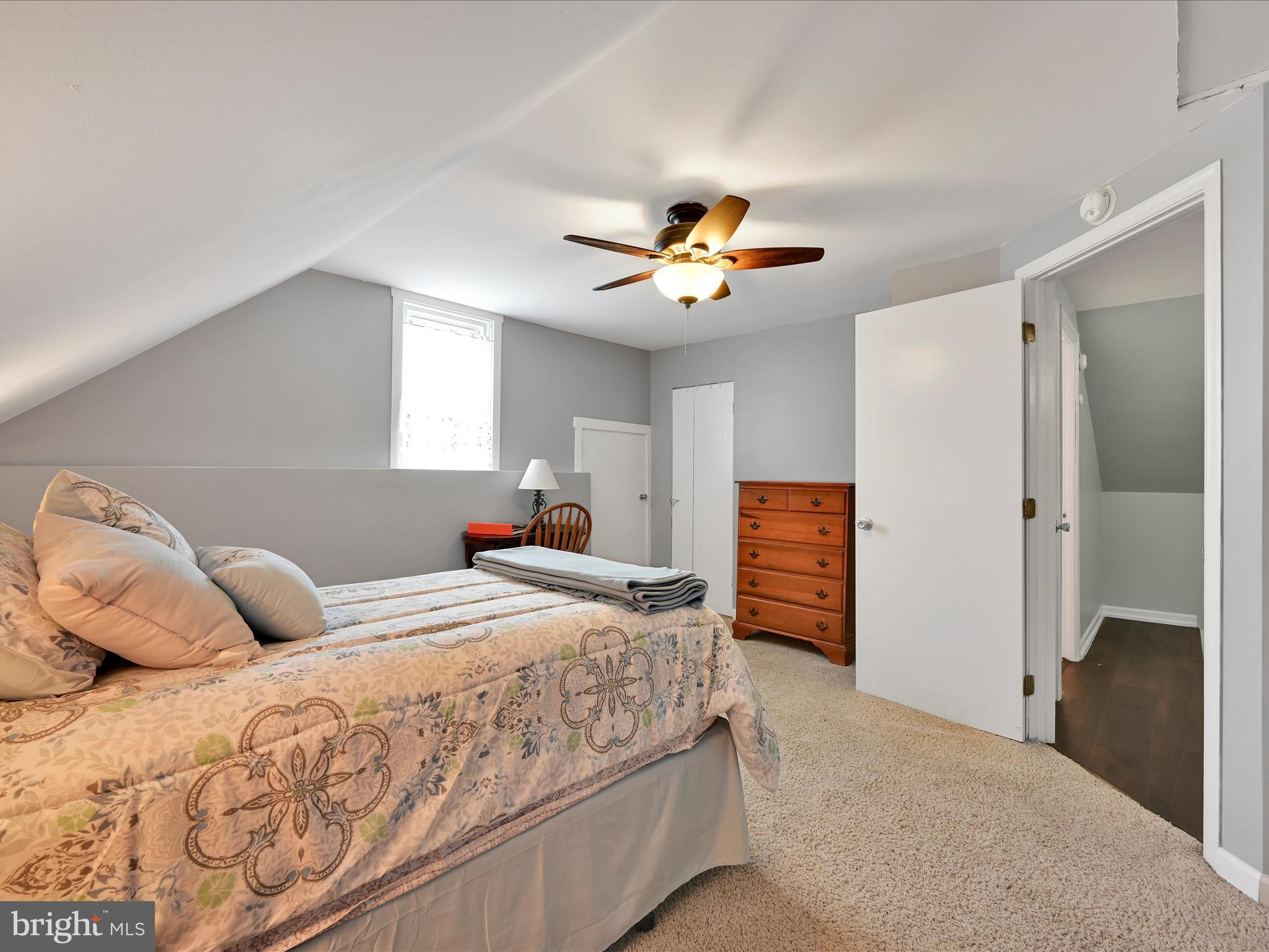 5 Hershey Road Lititz, PA 17543 - Photo 17 of 32 a bedroom with a bed and a chandelier