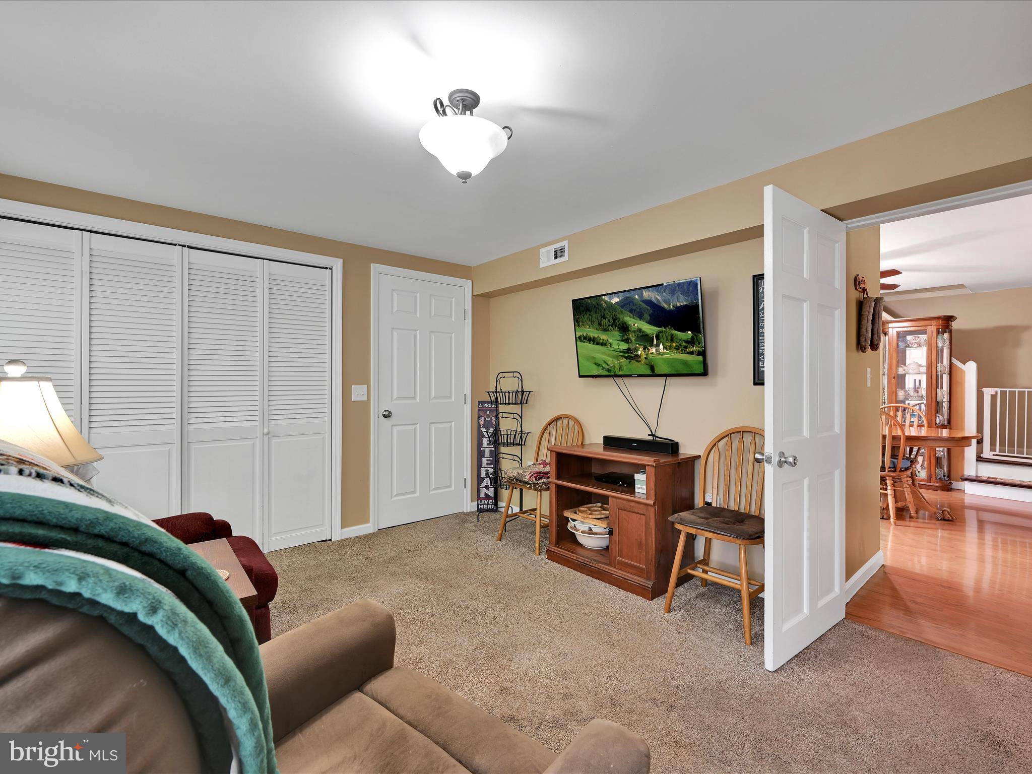 5 Hershey Road Lititz, PA 17543 - Photo 23 of 32 a living room with furniture and a chandelier