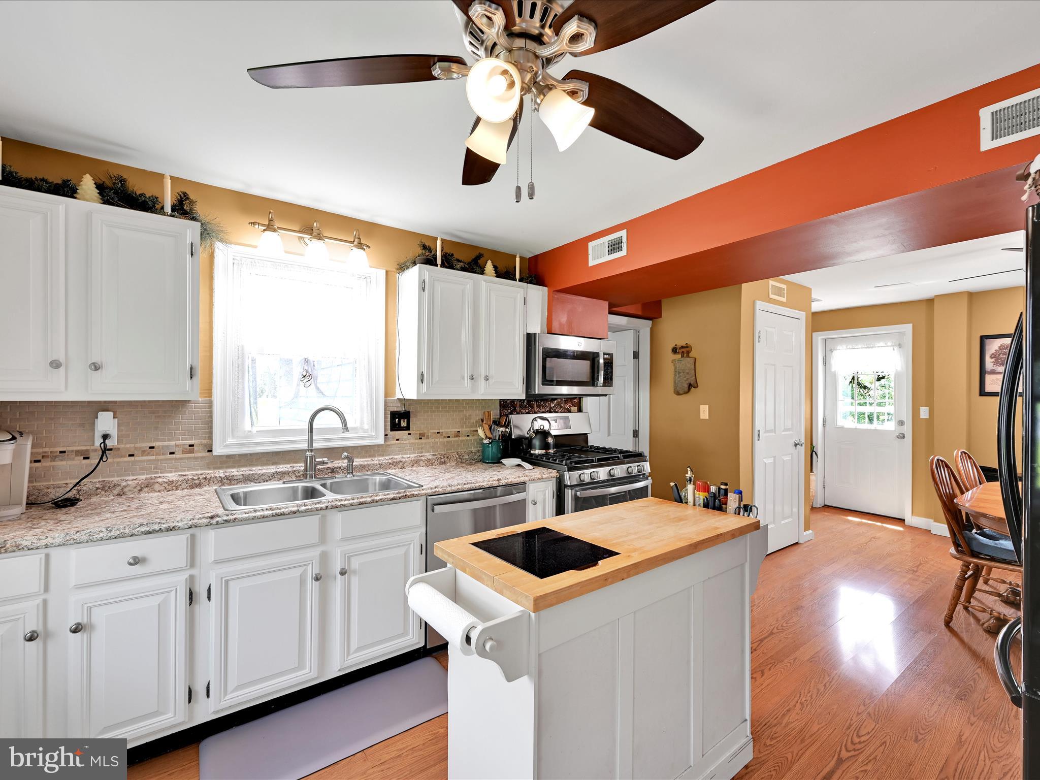 5 Hershey Road Lititz, PA 17543 - Photo 4 of 32 a kitchen with a sink a stove and cabinets