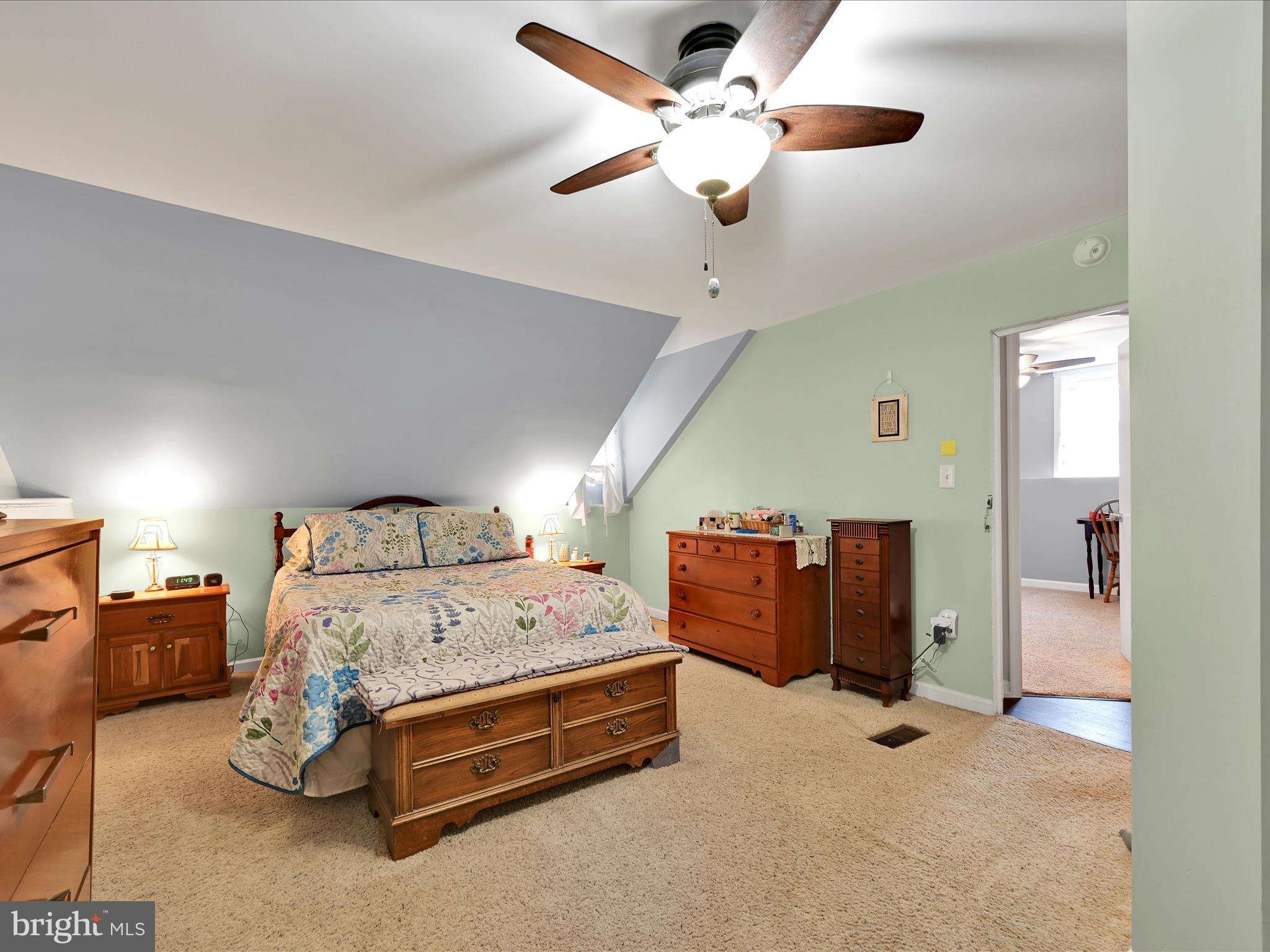 5 Hershey Road Lititz, PA 17543 - Photo 5 of 32 a bedroom with a bed and a ceiling fan