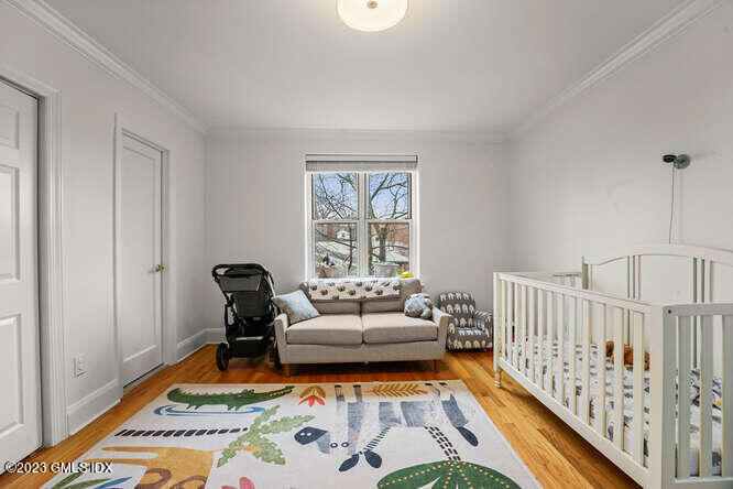 25 West Elm Street, Unit 40 Greenwich, CT 06830 - Photo 19 of 25 a bedroom with furniture and a rug