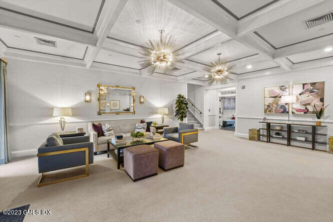 25 West Elm Street, Unit 40 Greenwich, CT 06830 - Photo 2 of 25 a living room with furniture and a chandelier