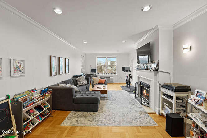 25 West Elm Street, Unit 40 Greenwich, CT 06830 - Photo 5 of 25 a living room with furniture and a flat screen tv
