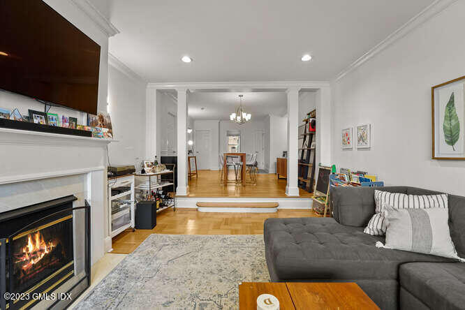 25 West Elm Street, Unit 40 Greenwich, CT 06830 - Photo 6 of 25 a living room with fireplace furniture and a flat screen tv