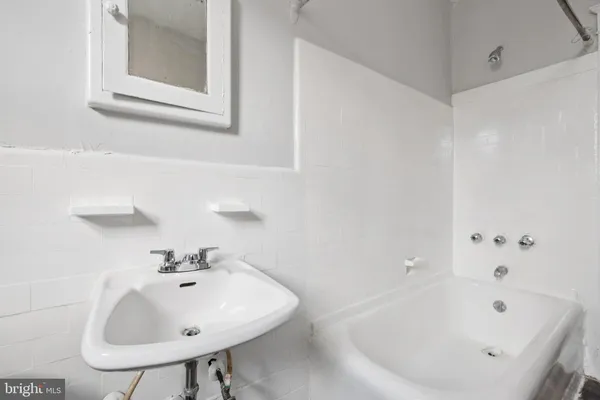a bathroom with a sink and a bathtub