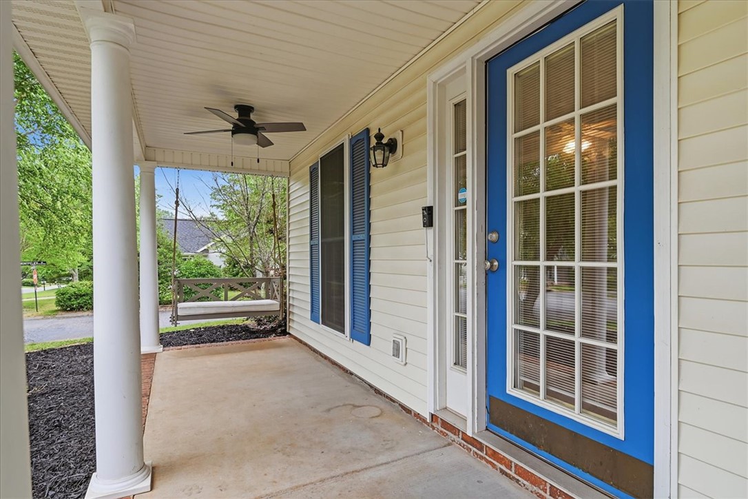 101 Grand Oak Circle Pendleton, SC 29670 - Photo 5 of 40 A welcoming front porch features a charming porch swing, ideal for relaxed afternoons.