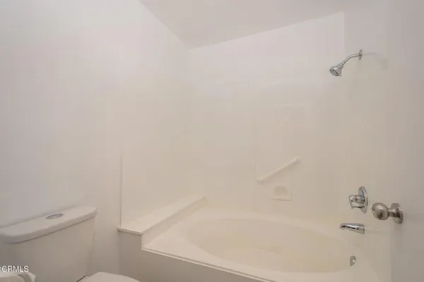 a close up of a bathtub in a bathroom