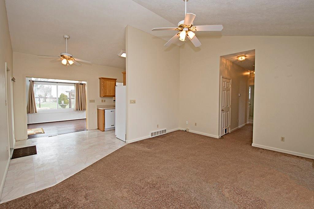 313 Quail Ridge Court Gibsonia, PA 15044 - Photo 14 of 15 Living Room with view of Kitchen/Breakfast Room/Sun Room and Hallway to Bedrooms. PLUS the door to the Finished Basement.