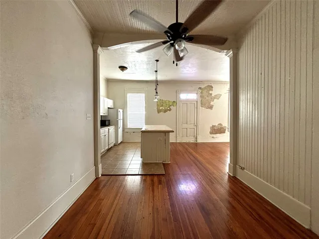 a view of a living room with hardwood floor