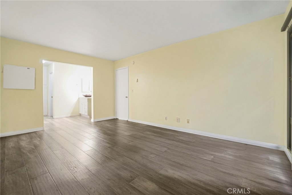 8650 Gulana Avenue Playa del Rey, CA 90293 - Photo 14 of 46 a view of an empty room with wooden floor and a window