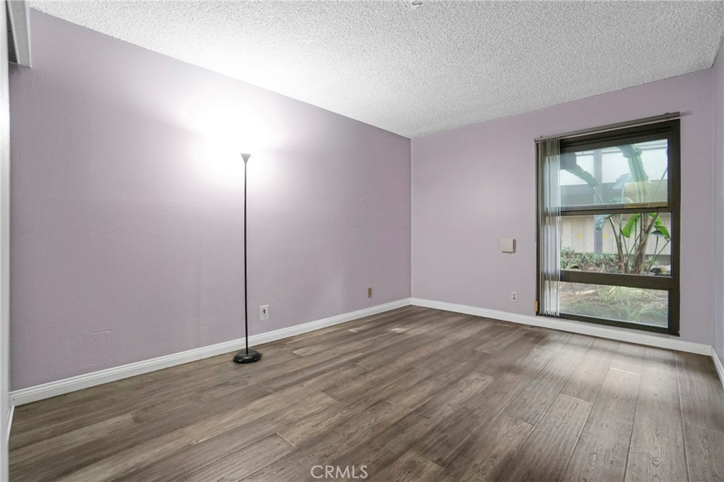 8650 Gulana Avenue Playa del Rey, CA 90293 - Photo 20 of 46 an empty room with wooden floor and windows