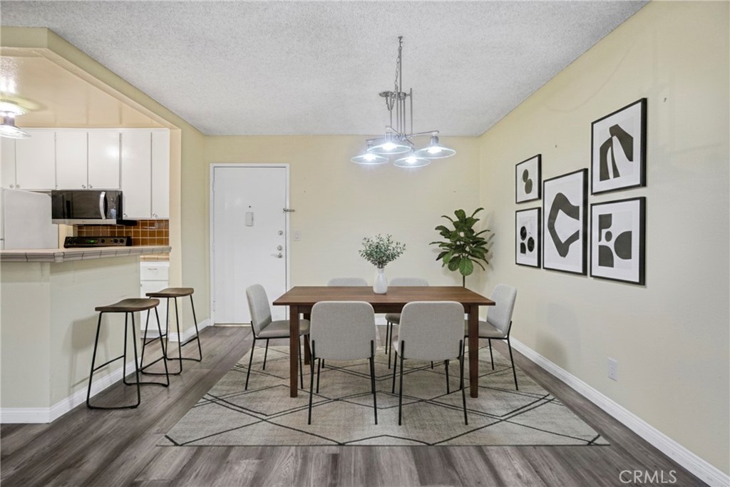 8650 Gulana Avenue Playa del Rey, CA 90293 - Photo 2 of 46 a view of a dining room with furniture and chandelier