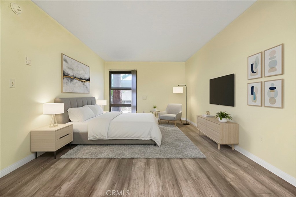 8650 Gulana Avenue Playa del Rey, CA 90293 - Photo 3 of 46 a spacious bedroom with a bed and a flat screen tv