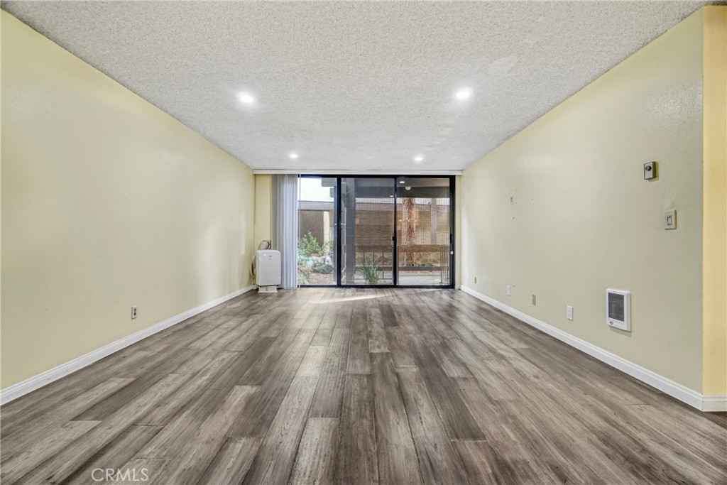 8650 Gulana Avenue Playa del Rey, CA 90293 - Photo 5 of 46 wooden floor in an empty room with a window