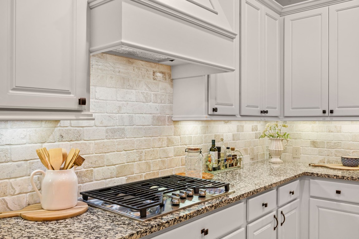 1607 Dove Ridge Drive Katy, TX 77493 - Photo 13 of 38 a kitchen with a stove and cabinets