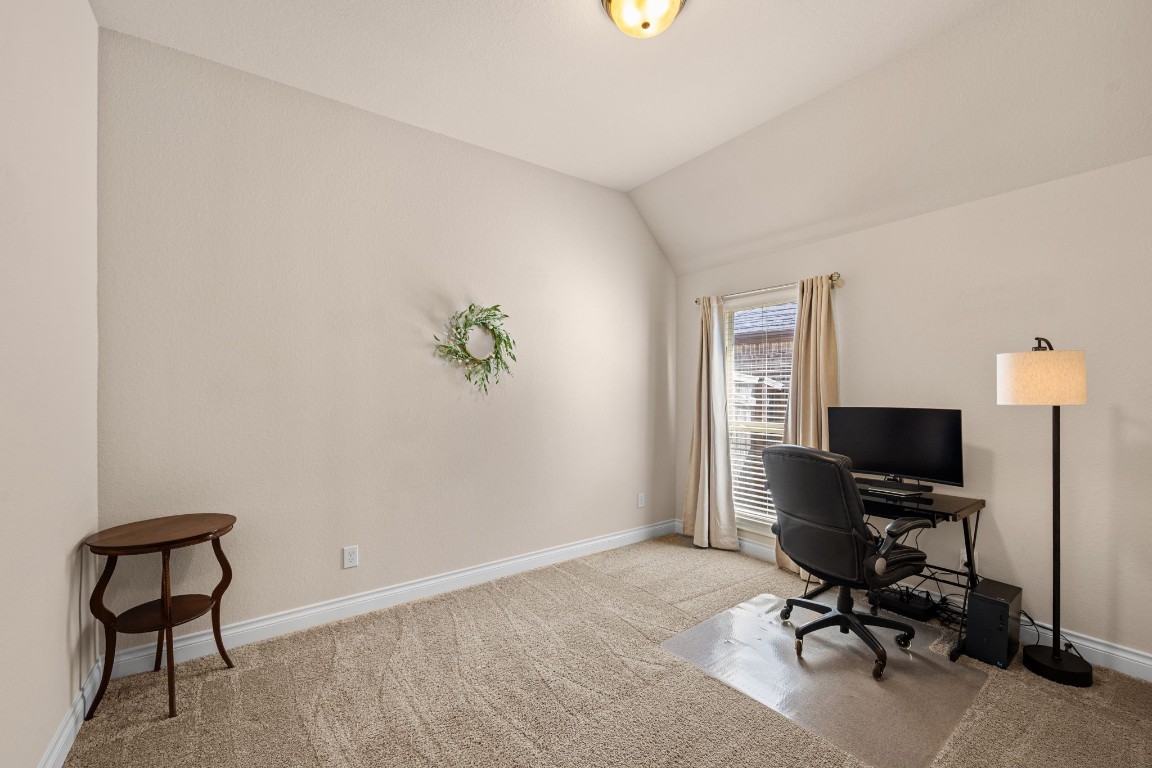 1607 Dove Ridge Drive Katy, TX 77493 - Photo 31 of 38 a view of a workspace with furniture and a window