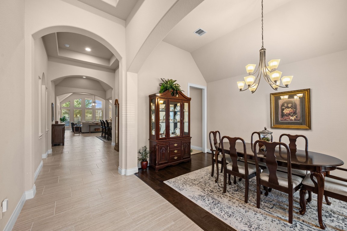 1607 Dove Ridge Drive Katy, TX 77493 - Photo 6 of 38 a view of a dining room with furniture and chandelier