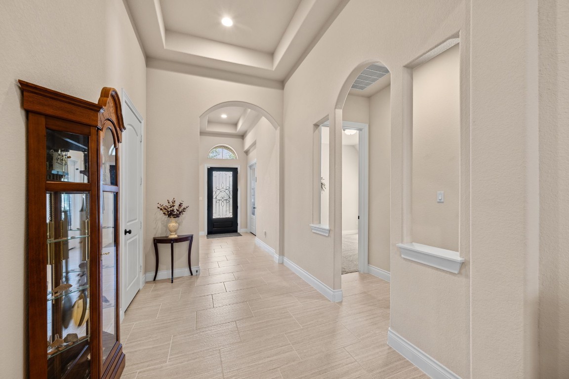 1607 Dove Ridge Drive Katy, TX 77493 - Photo 8 of 38 a view of a hallway with wooden floor windows and a livingroom