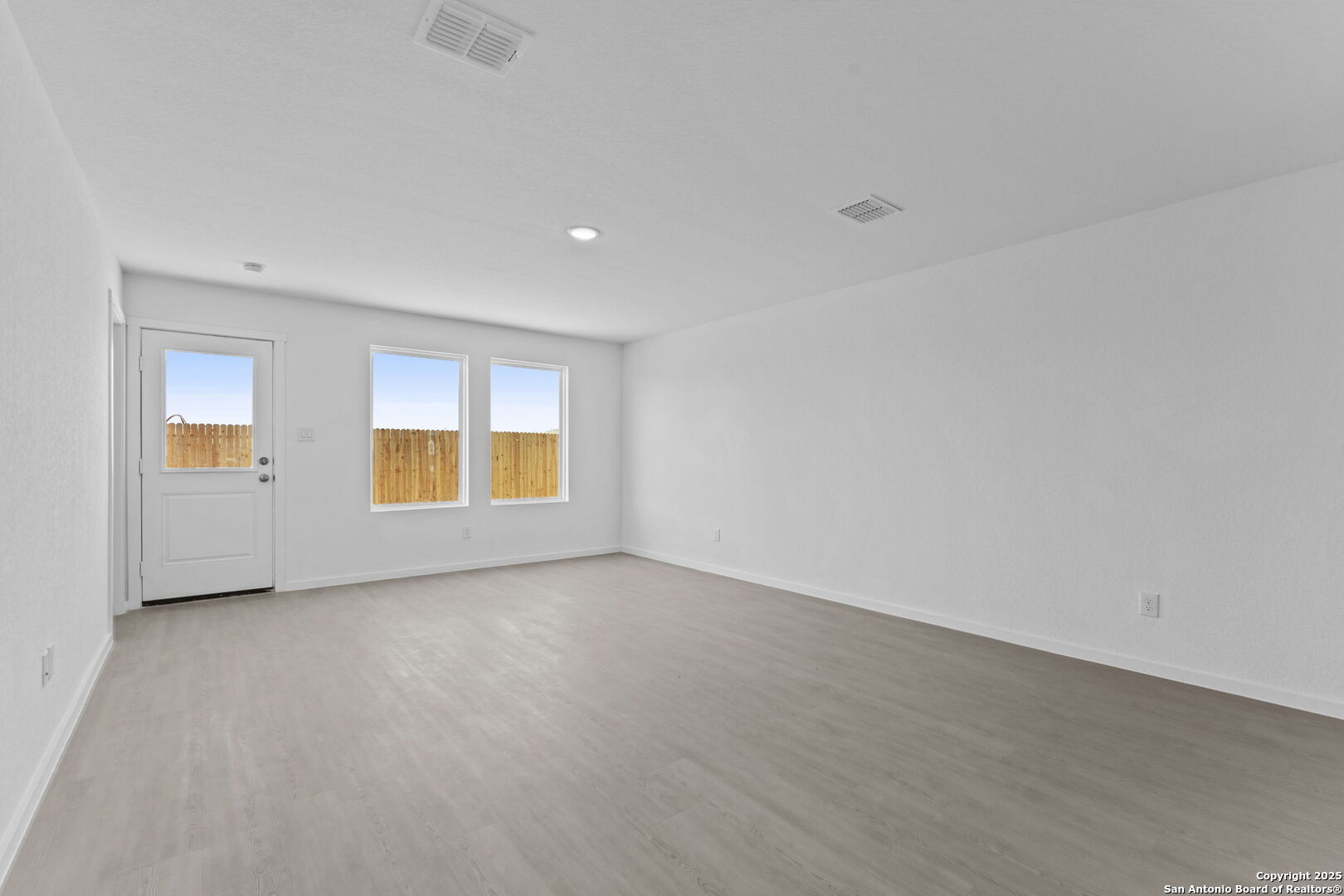 2067 Powell Place Converse, TX 78109 - Photo 15 of 22 an empty room with windows