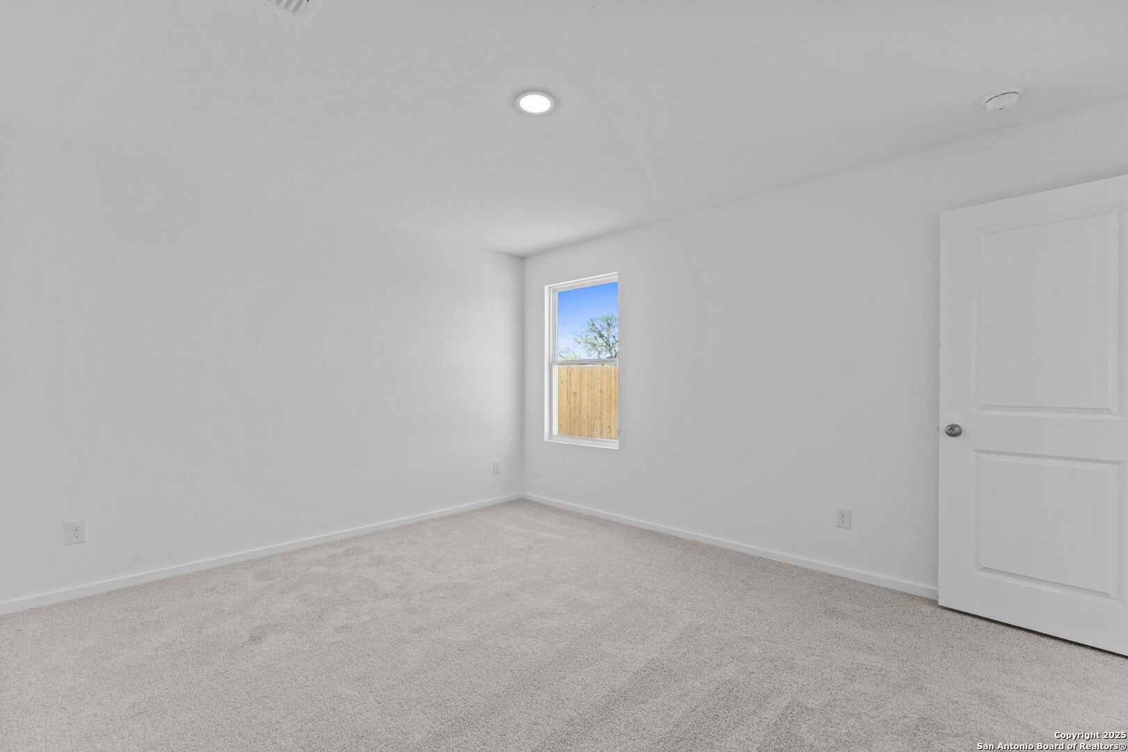 2067 Powell Place Converse, TX 78109 - Photo 18 of 22 a view of an empty room and window