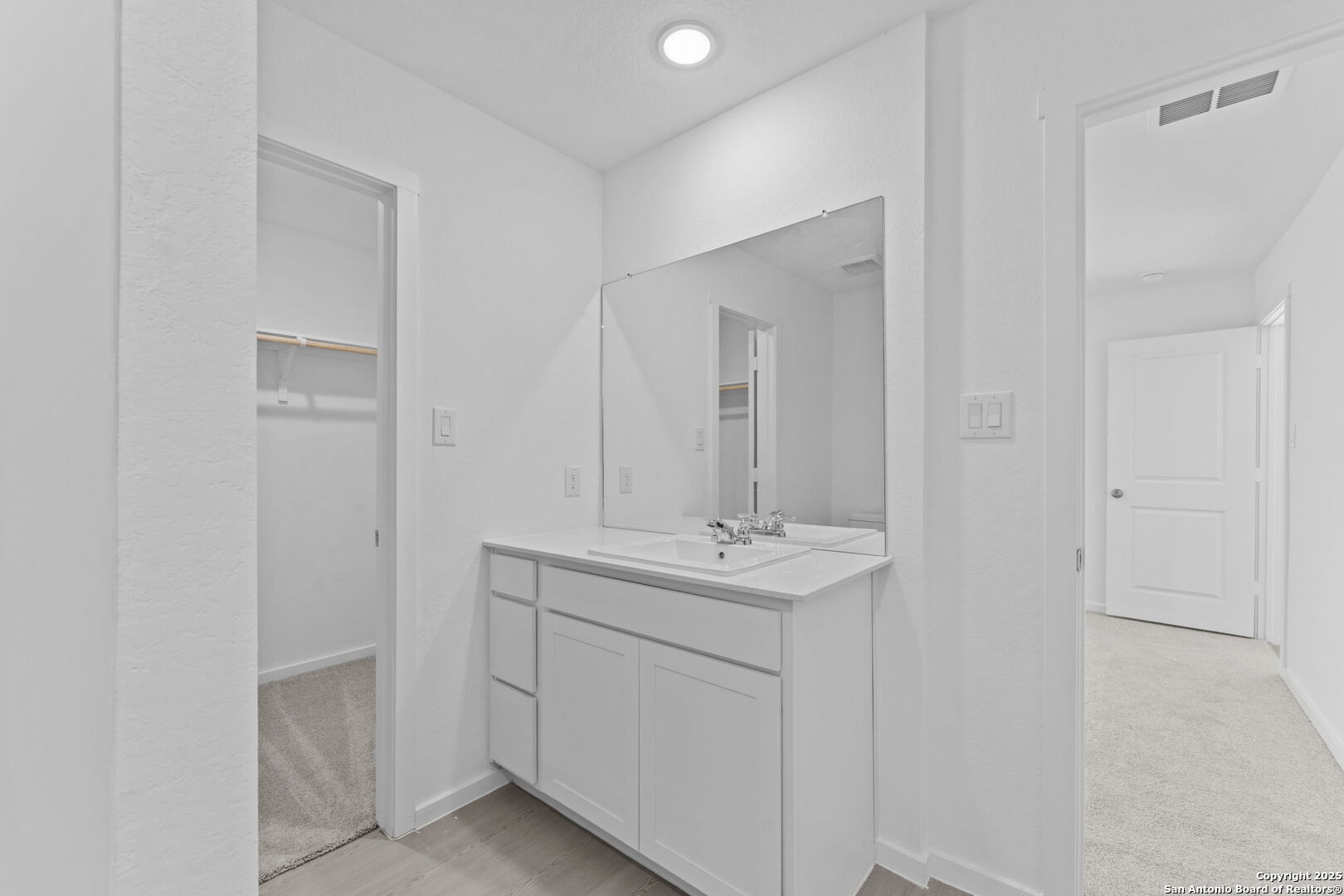 2067 Powell Place Converse, TX 78109 - Photo 20 of 22 a bathroom with a sink a toilet and a mirror