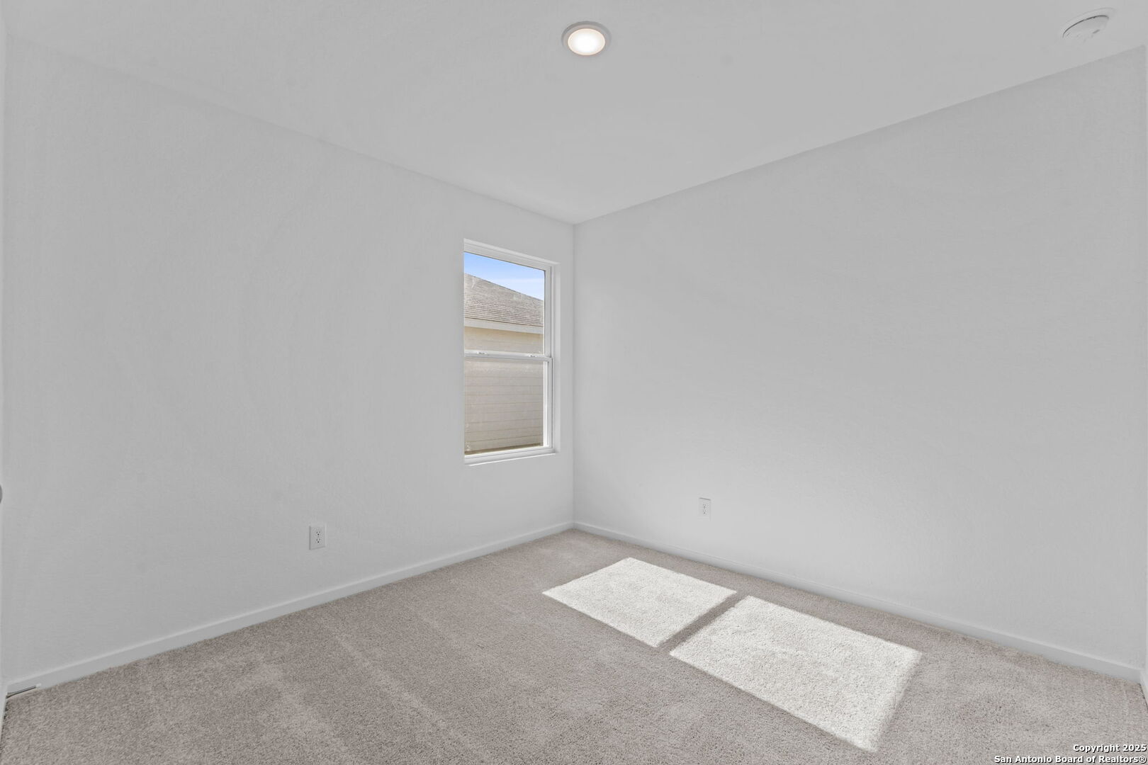 2067 Powell Place Converse, TX 78109 - Photo 7 of 22 a view of an empty room with a window