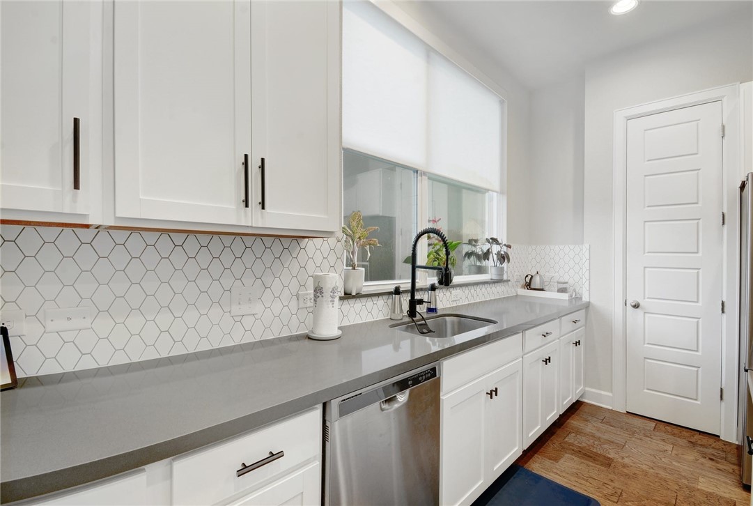 4405 Swift Path, Unit 17 Austin, TX 78741 - Photo 10 of 33 a kitchen with a sink and cabinets