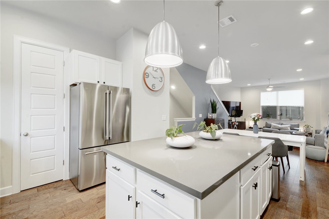 4405 Swift Path, Unit 17 Austin, TX 78741 - Photo 33 of 33 a kitchen with sink a refrigerator and chairs