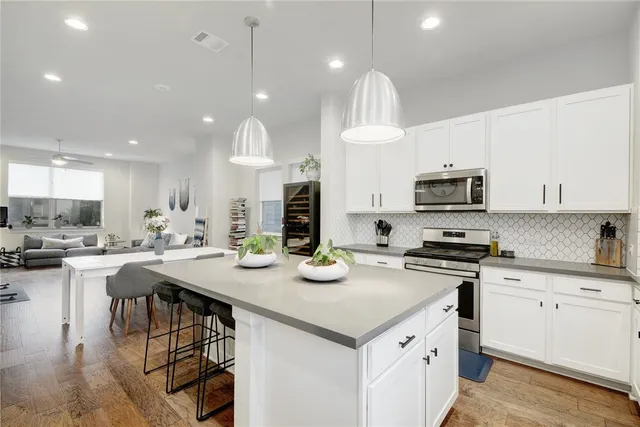 a kitchen with a sink and cabinets