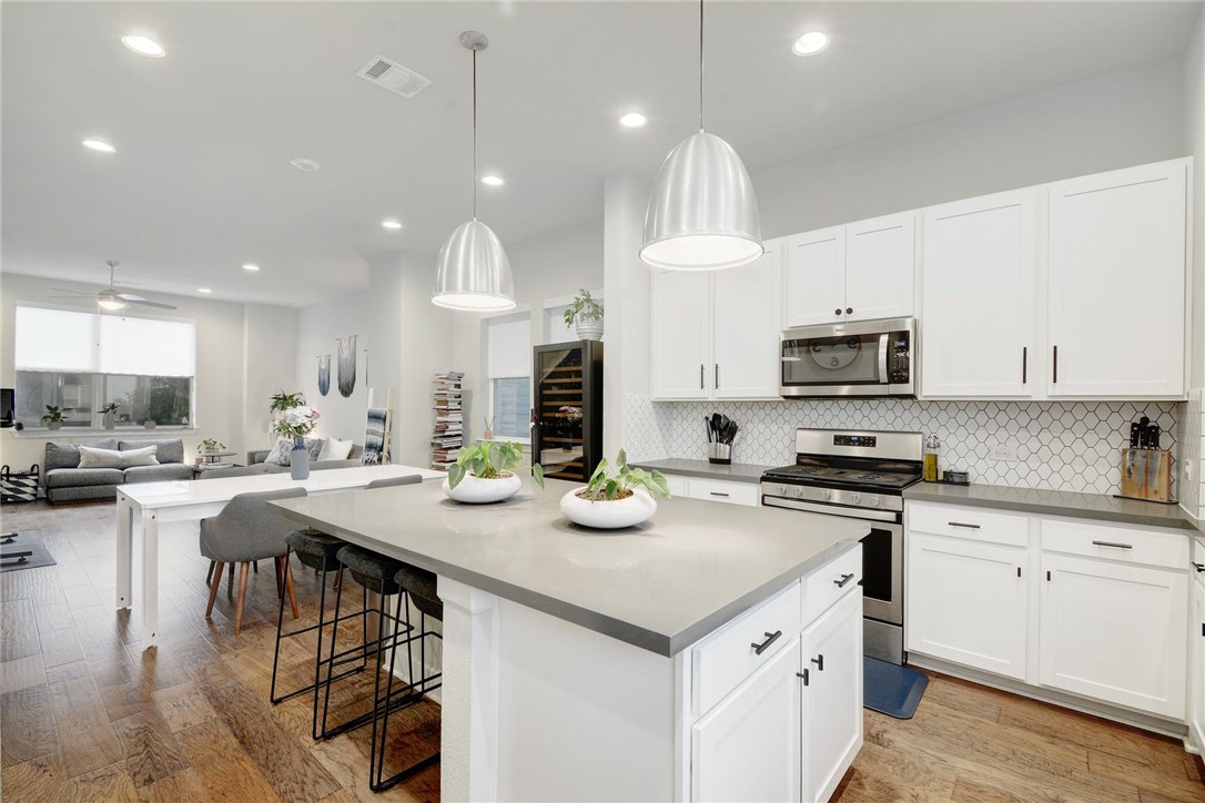 4405 Swift Path, Unit 17 Austin, TX 78741 - Photo 11 of 33 a kitchen with sink a stove and cabinets