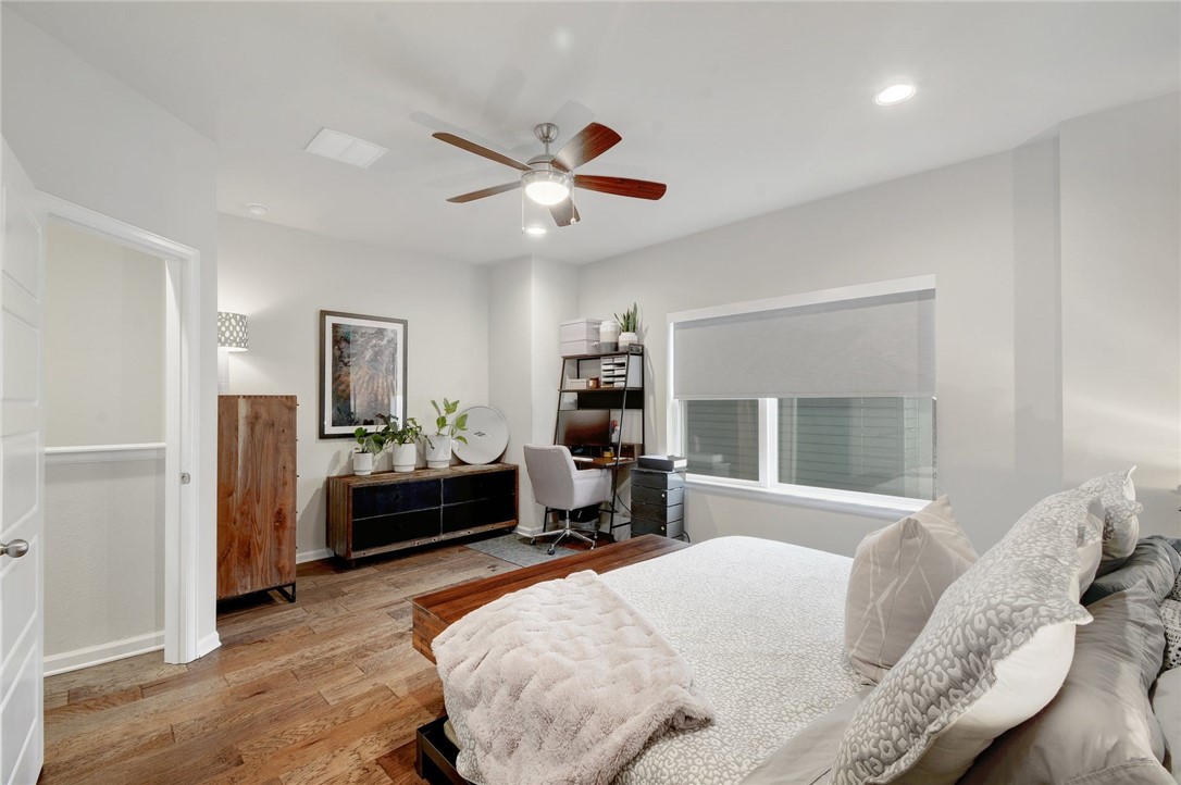 4405 Swift Path, Unit 17 Austin, TX 78741 - Photo 13 of 33 a bed room with a bed and furniture