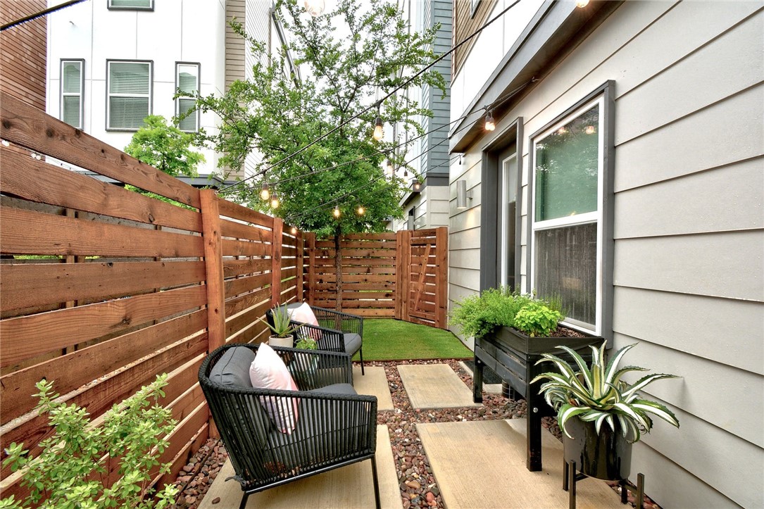 4405 Swift Path, Unit 17 Austin, TX 78741 - Photo 22 of 33 a view of a chair and table in the patio with potted plants