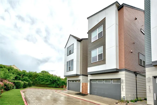 a view of a wooden fence and trees