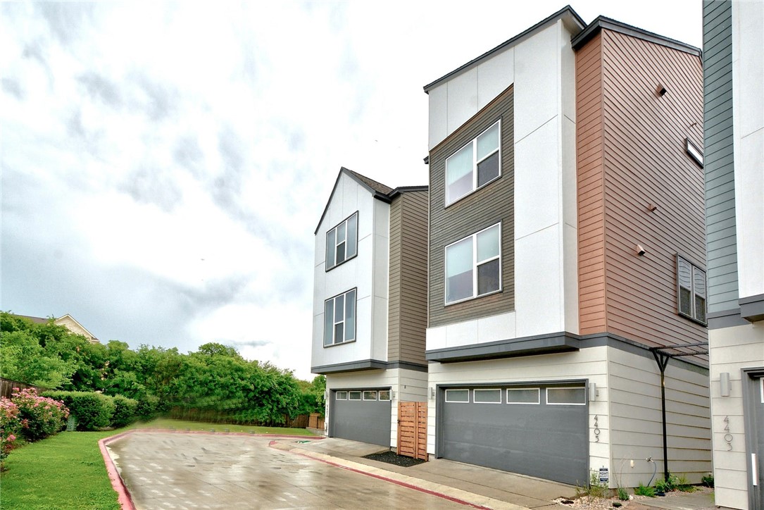 4405 Swift Path, Unit 17 Austin, TX 78741 - Photo 24 of 33 a front view of a house with a yard