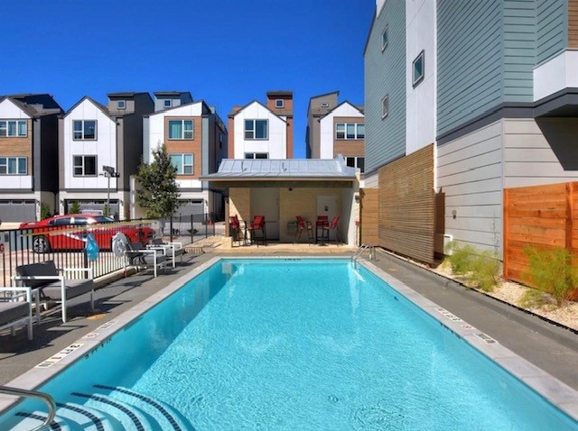 4405 Swift Path, Unit 17 Austin, TX 78741 - Photo 25 of 33 a view of a house with swimming pool in front of it