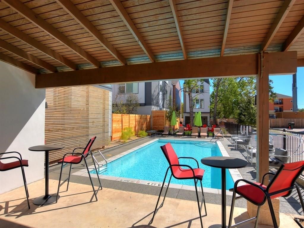 4405 Swift Path, Unit 17 Austin, TX 78741 - Photo 27 of 33 a patio with a table and chairs