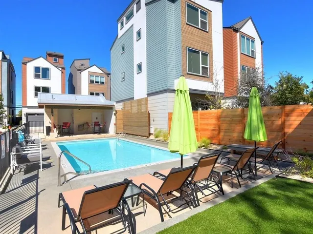 a patio with a table and chairs