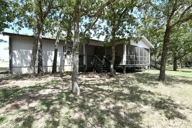 a view of a dining room with furniture and a window