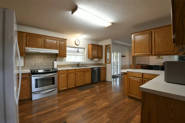 a view of a dining room with furniture and a window