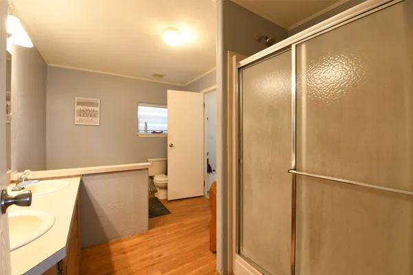 a bedroom with two beds and a window