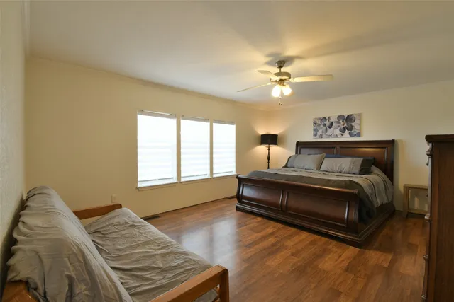 a bedroom with two beds and a window