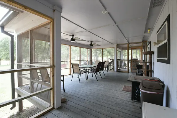 a view of a lake with houses in the background