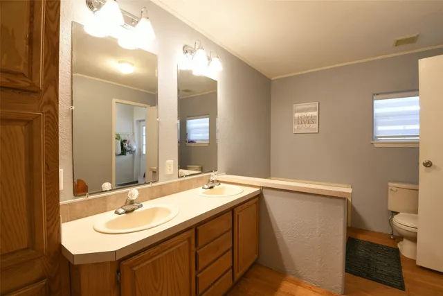 a view of a lake with houses in the background