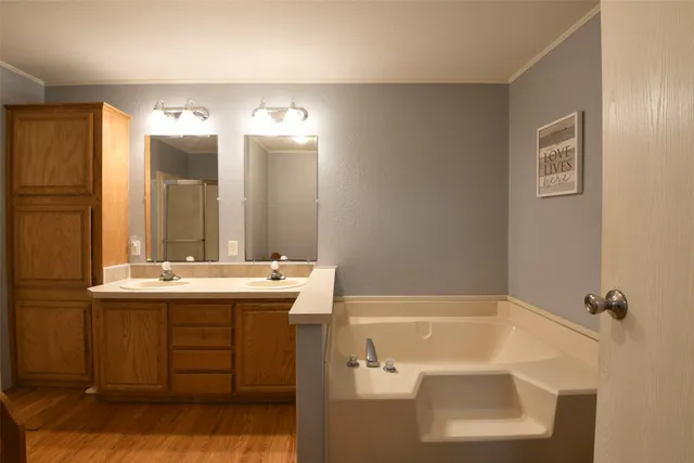 a view of a lake with houses in the back