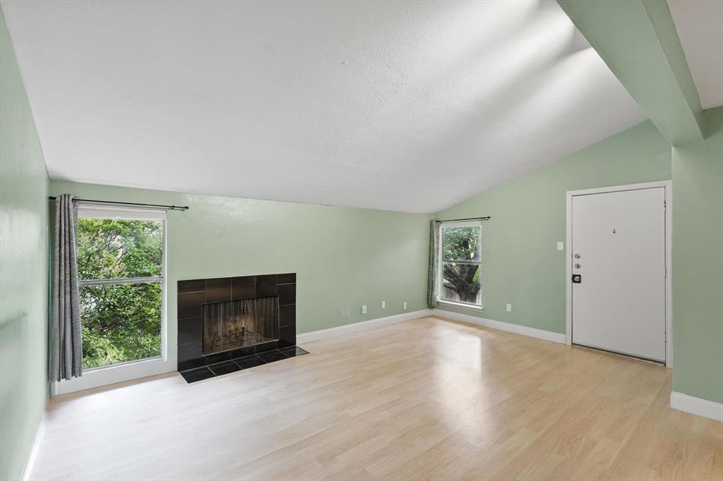 12824 Midway Road, Unit 2136 Dallas, TX 75244 - Photo 11 of 40 a view of empty room with a fireplace