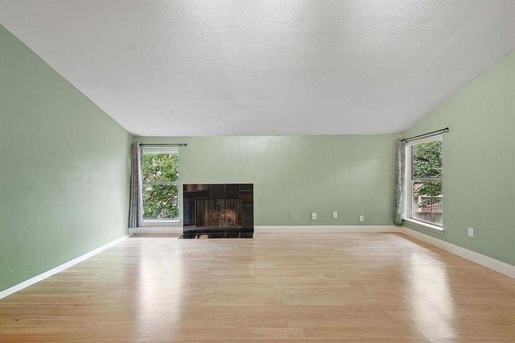 12824 Midway Road, Unit 2136 Dallas, TX 75244 - Photo 13 of 40 a view of empty room with a fireplace