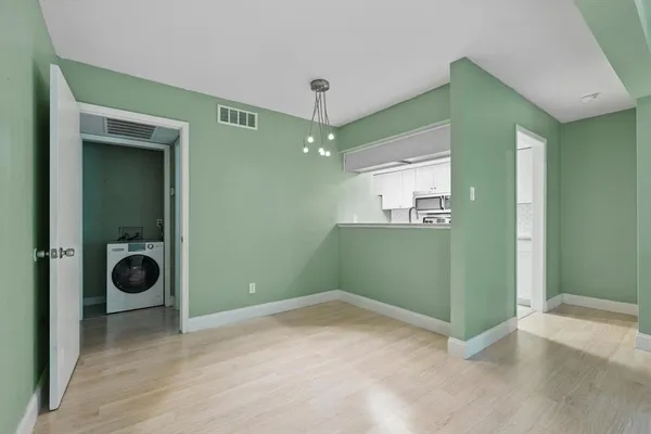 a view of a room that has a washer and dryer