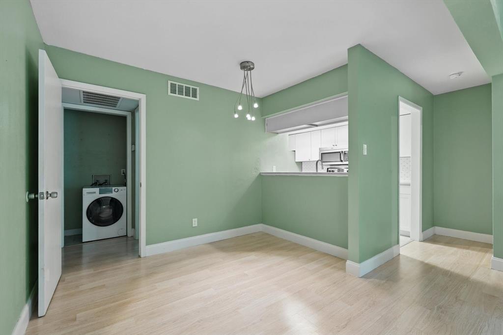 12824 Midway Road, Unit 2136 Dallas, TX 75244 - Photo 16 of 40 a view of a room that has a washer and dryer