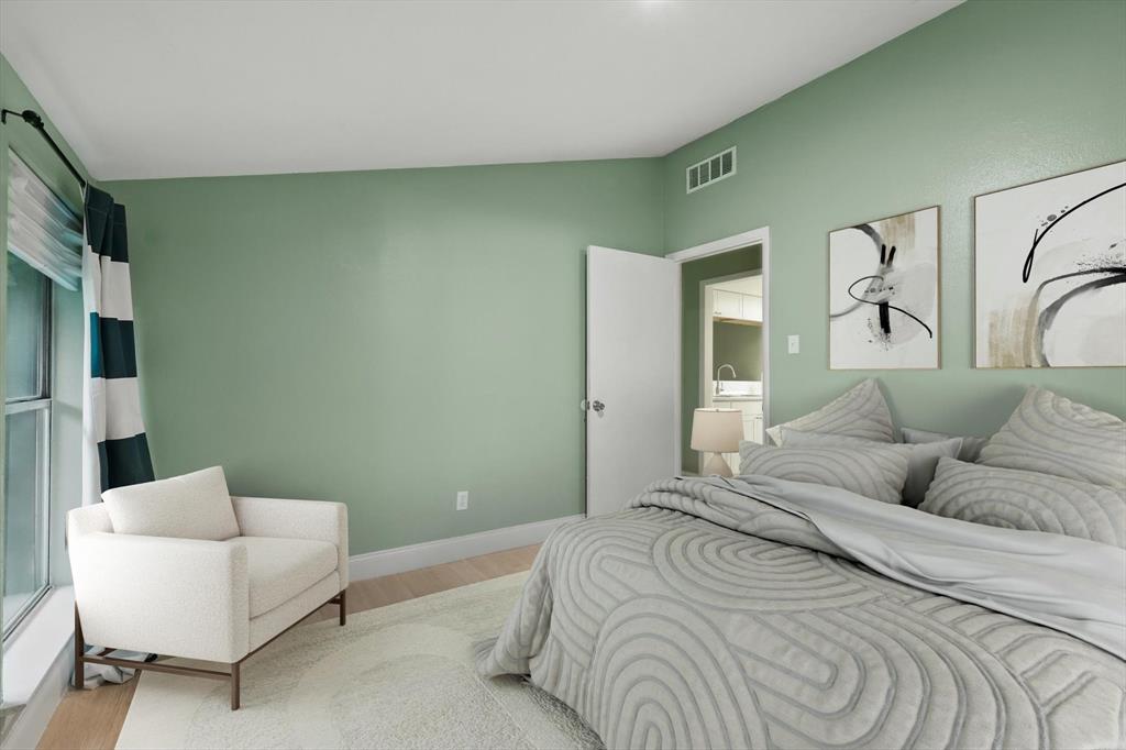 12824 Midway Road, Unit 2136 Dallas, TX 75244 - Photo 21 of 40 a bedroom with a bed couch and a window